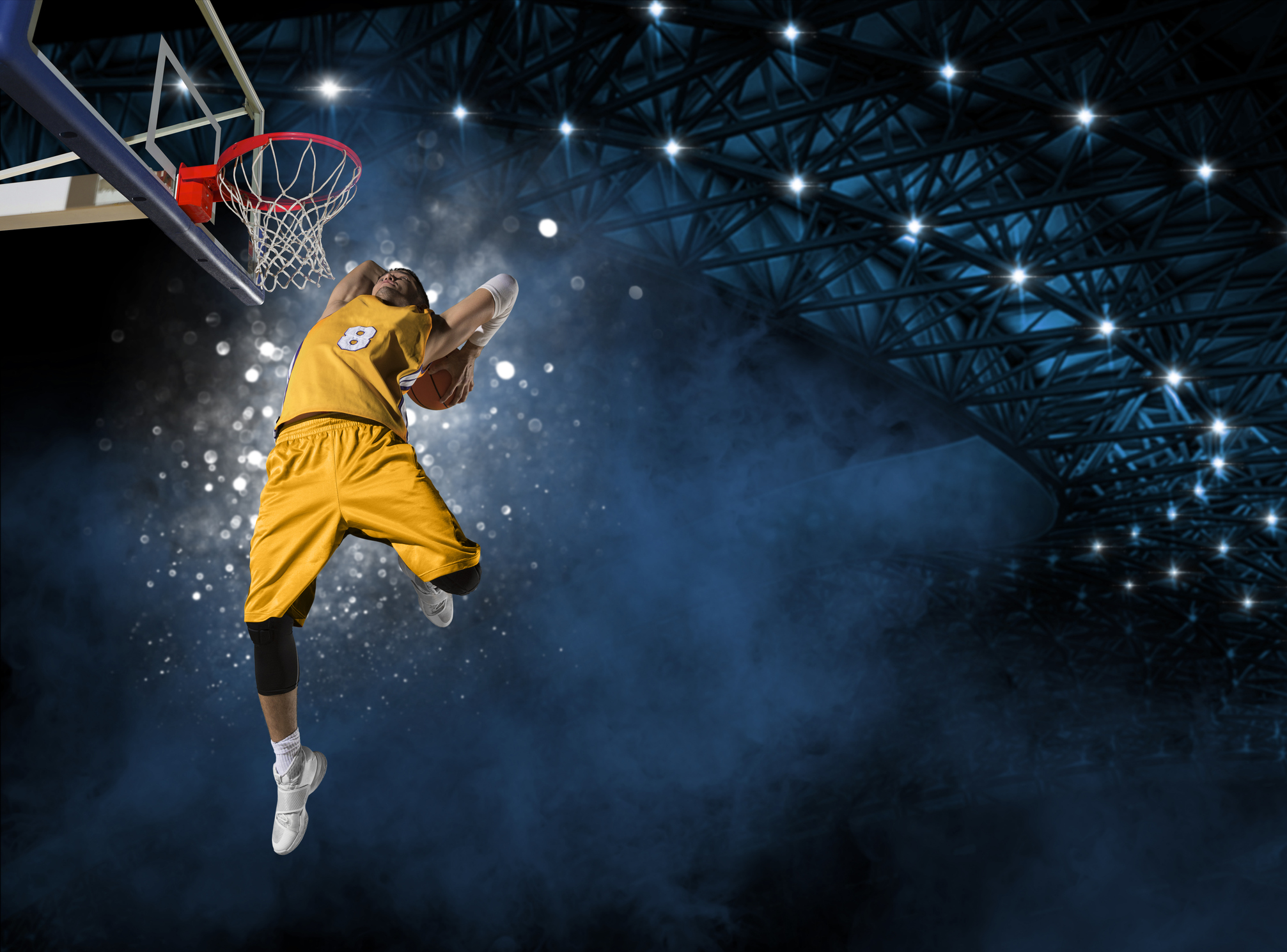 Basketball player players in action. Basketball concept on dark smoke background